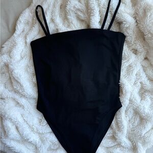 Brand new women's black bodysuit with straps